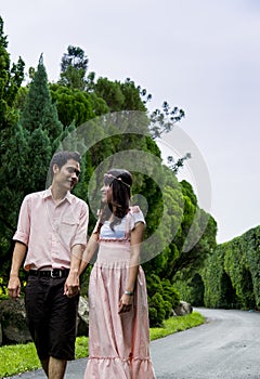 Lovely couple walk together in the garden3