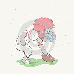 Lovely cute rhino dressed like American Football player with ball in field. Young dressed rhino