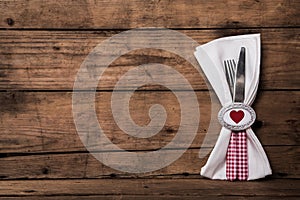 Lovely cutlery in red in white checked with heart and a napkin o