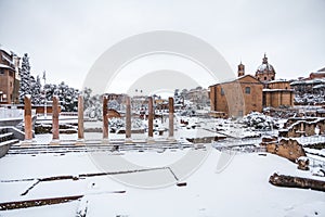 A lovely day of snow in Rome, Italy, 26th February 2018: a beautiful view of snowy Roman Forums and Church of the Saints Luca and