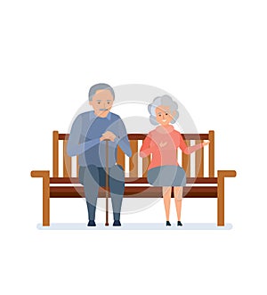 Lovely elderly couple sitting on a bench, they relax, communicate.