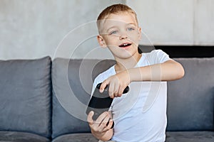 Lovely energetic boy playing video games