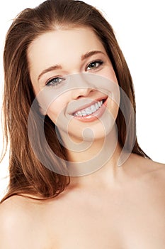 Lovely in every way. Studio shot of a beautiful young woman posing with bare shoulders.