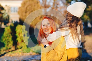 Lovely family laughing on autumn walk. Autumn holidays, lifestyle