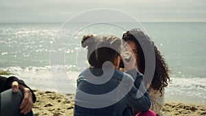 Lovely family playing photographing at beach. Mom child taking photos outdoors.