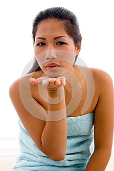 Lovely female model posing with flying kiss