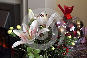 Lovely festive Christmas flower arrangement with lilies and carnations