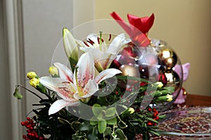 Lovely festive Christmas flower arrangement with lilies and carnations