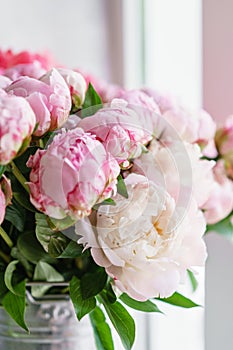 Lovely flowers in glass vase. Beautiful bouquet of pink peonies . Floral composition, scene, daylight. Wallpaper