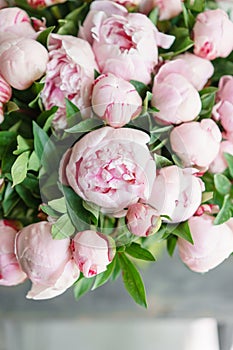 Lovely flowers in glass vase. Beautiful bouquet of pink peonies . Floral composition, scene, daylight. Wallpaper