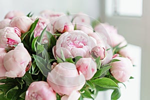 Lovely flowers in glass vase. Beautiful bouquet of pink peonies . Floral composition, scene, daylight. Wallpaper