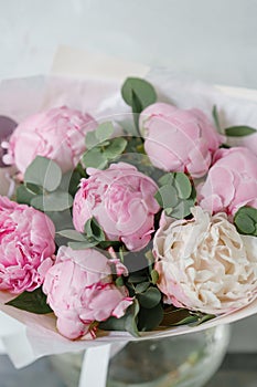 Lovely flowers in glass vase. Beautiful bouquet of pink peonies . Floral composition, scene, daylight. Wallpaper