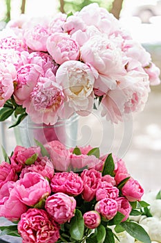 Lovely flowers in glass vase. Beautiful bouquet of pink peonies . Floral composition, scene, daylight. Wallpaper