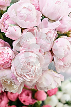 Lovely flowers in glass vase. Beautiful bouquet of pink peonies . Floral composition, scene, daylight. Wallpaper