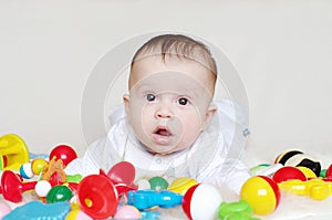 Lovely four-months baby with toys