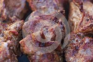 Lovely fresh pieces of smoked meat shish kebab fried on charcoal grill.