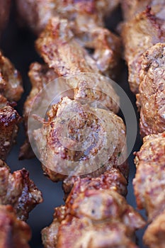 Lovely fresh pieces of smoked meat shish kebab fried on charcoal grill.