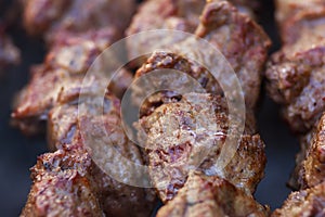 Lovely fresh pieces of smoked meat shish kebab fried on charcoal grill.