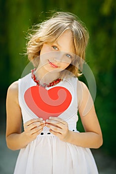 Lovely girl holding heart shape