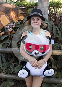 Lovely girl holding a stuffed Panda