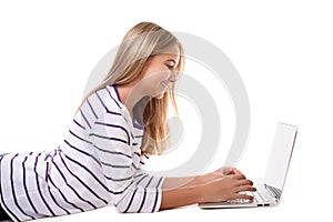 Lovely girl laying on the floor using laptop isolated