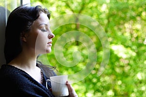 Lovely girl with a mug of coffee