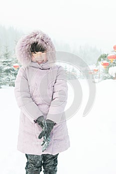 A lovely girl playing snow