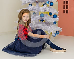 Lovely Girl Posing in Front of Decorated White Christmas Tree.