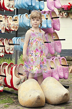 Lovely girl in typical dutch huge wooden clogs