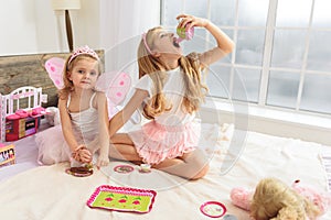 Lovely girls enjoying bun-fight at home