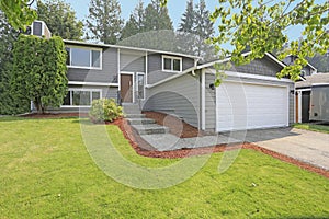 Lovely grey rambler house exterior features grey siding