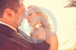 Lovely Groom and bride outdoors on a sunny day