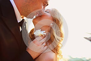 Lovely Groom and bride outdoors on a sunny day