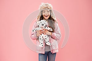 Lovely happy kid friendly dog. Charity and donation concept. Positive emotions. Happy small smiling child play with soft