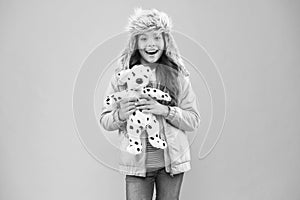 Lovely happy kid friendly dog. Charity and donation concept. Positive emotions. Happy small smiling child play with soft