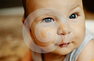 Lovely Happy Smiling Baby Close-up. Infant Playing Home.
