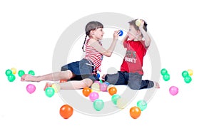 A lovely kids are playing with balls