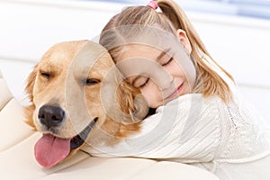 Lovely little girl and her pet dog photo