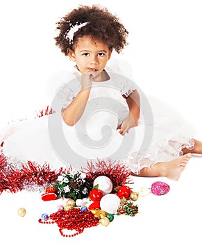 Lovely little girl playing with Christmas toys