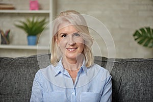 Lovely middle aged blond woman with a beaming smile