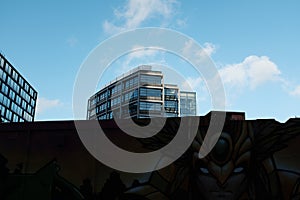 A lovely modern skyscraper under a stunning cloudy blue sky, Shoreditch, Uk