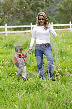 Lovely mother and boy walking outdoors
