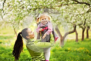 Lovely mother and child together outdoors in sunny
