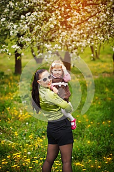 Lovely mother and child together smiling outdoors