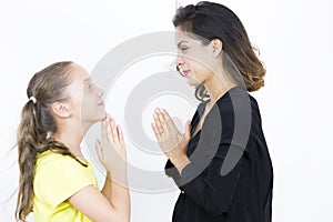 Lovely Mother and Daughter Praying Together