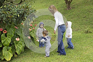 Lovely Mother With Her Children Outdoors