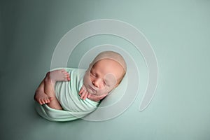 Lovely newborn baby boy sleaping confort pose