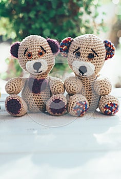 Lovely pair of teddy bears on a wooden table