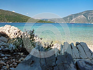 Lovely pebbly beach with crystal clear sea of the Ithaca island, Molos Gulf, Ionian Sea, Greece
