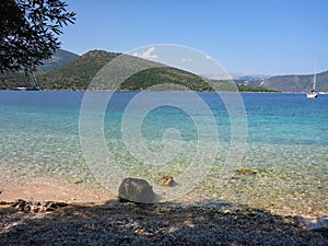 Lovely pebbly beach with crystal clear sea of the Ithaca island, Molos Gulf, Ionian Sea, Greece